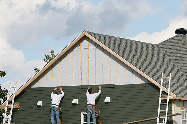 Professional Storm Damage Siding Repair technician working in Union City, NJ